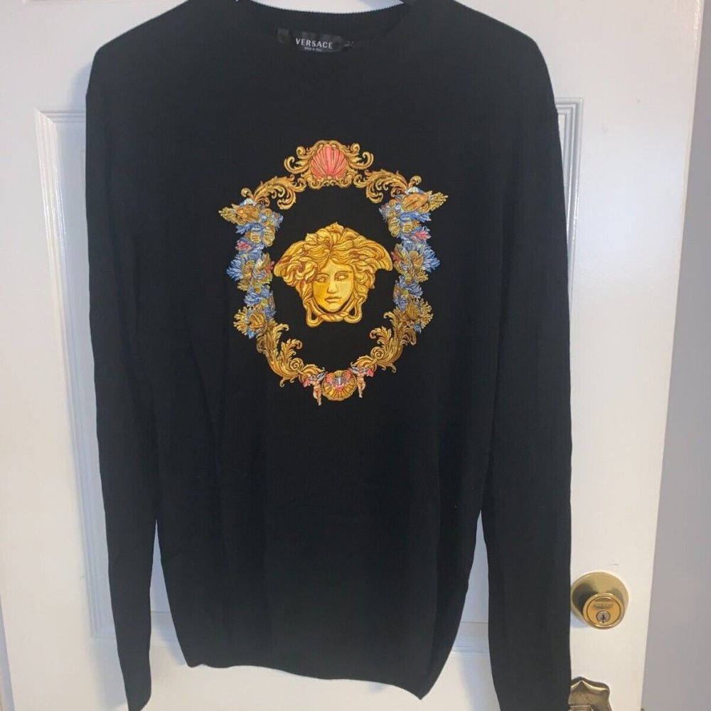 Versace Black Crewneck Sweater with Gold Medusa Crest and Blue Floral Accents